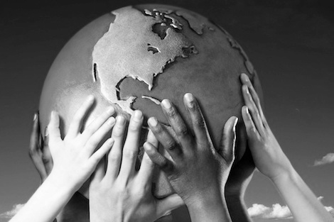Hands on a globe --- Image by © Royalty-Free/Corbis