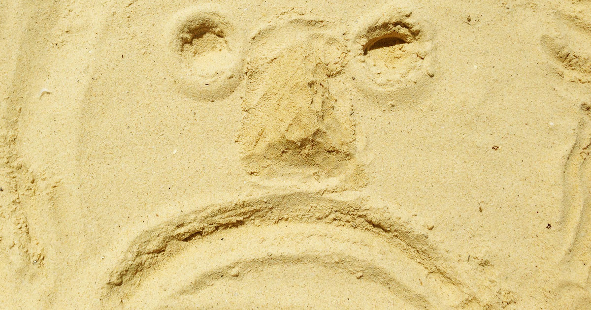 visage-triste-sable